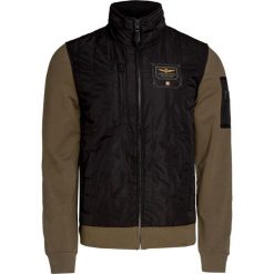 Bluza AERONAUTICA MILITARE. Zielone bluzy męskie Aeronautica Militare, na lato, z haftami, z nylonu, militarne, z kapturem, bez rękawów, bez kaptura. W wyprzedaży za 770,00 zł.