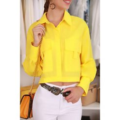 Koszula damska JIANA YELLOW. Żółte bluzki damskie IVET, na co dzień, bez wzorów, eleganckie, bez kołnierzyka, bez rękawów. W wyprzedaży za 69,00 zł.