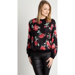 Bluzka w kwiecisty wzór RABARBAR. Różowe bluzki sportowe damskie RABARBAR, s, w kwiaty, z tkaniny, bez kołnierzyka, bez rękawów, bez kaptura. W wyprzedaży za 123,00 zł.