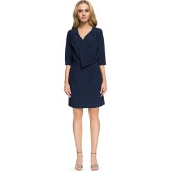 LYLA Sukienka kopertowa z dekoltem - granatowa. Niebieskie sukienki damskie Stylove, na imprezę, s, bez wzorów, eleganckie, z wykładanym kołnierzem, bez rękawów, mini, kopertowe. Za 179,90 zł.