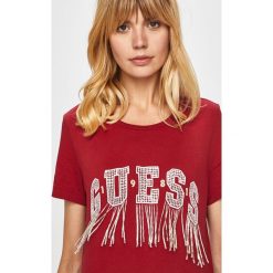 Guess Jeans - T-shirt. Czarne bluzki damskie Guess Jeans, s, z aplikacjami, z bawełny, z okrągłym kołnierzem, z krótkim rękawem. W wyprzedaży za 179,90 zł.