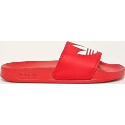 Adidas Originals - Klapki Adilette. Czerwone klapki damskie adidas Originals, bez wzorów, z gumy, bez obcasa, na obcasie. Za 129,90 zł.