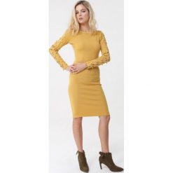 Żółta Sukienka Reina. Żółte sukienki damskie Born2be, na zimę, s, bez wzorów, z dzianiny, bez kołnierzyka, bez rękawów, mini. Za 99,99 zł.