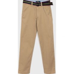 Polo Ralph Lauren - Spodnie dziecięce 134-158 cm. Brązowe spodnie chłopięce Polo Ralph Lauren, w paski, z elastanu. W wyprzedaży za 179,90 zł.