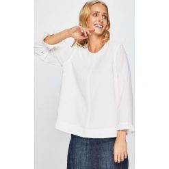 Tommy Hilfiger - Koszula. Białe bluzki damskie TOMMY HILFIGER, na co dzień, s, bez wzorów, z poliesteru, eleganckie, z okrągłym kołnierzem, z długim rękawem. W wyprzedaży za 269,90 zł.