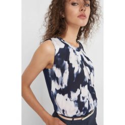 Koszula bimaterial ze wzorem. Niebieskie koszule wiązane damskie Orsay, xs, z dzianiny, z dekoltem na plecach. Za 69,99 zł.