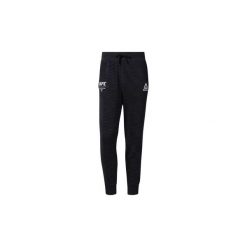 Spodnie treningowe Reebok Sport Spodnie dresowe UFC Fan Gear. Czarne spodnie męskie marki Reebok Sport, s, bez wzorów, z dresówki, sportowe. Za 229,00 zł.