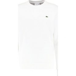 Lacoste Bluza farine. Białe kardigany męskie marki Lacoste, m, z bawełny. W wyprzedaży za 343,20 zł.