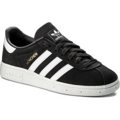 Buty adidas - Munchen CQ2322 Carbon/Ftwwht/Goldmt. Czarne buty sportowe damskie Adidas, bez wzorów, z zamszu, sportowe. W wyprzedaży za 239,00 zł.
