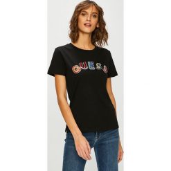 Guess Jeans - Top. Czarne bluzki damskie Guess Jeans, s, z aplikacjami, z bawełny, casualowe, z okrągłym kołnierzem, z krótkim rękawem. W wyprzedaży za 199,90 zł.