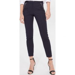 Spodnie cygaretki short length - Niebieski. Niebieskie spodnie damskie Mohito. Za 119,99 zł.