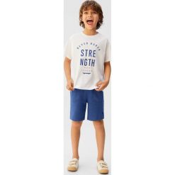 Mango Kids - T-shirt dziecięcy Minimal 110-164 cm. Białe t-shirty chłopięce Mango Kids, z nadrukiem, z bawełny, bez rękawów. Za 25,90 zł.