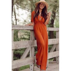 Kombinezon PANITA ORANGE. Pomarańczowe kombinezony damskie Kombinezon PANITA ORANGE, s, bez wzorów, bez kołnierzyka, bez rękawów. W wyprzedaży za 99,00 zł.