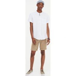 Lniana koszula z krótkim rękawem. Niebieskie koszule męskie Pull&Bear, m, bez wzorów, bez kołnierzyka, z krótkim rękawem. Za 62,90 zł.