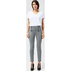 Legginsy w kratkę. Czarne spodnie damskie Moodo, l, w kratkę, z elastanu, klasyczne. Za 39,99 zł.