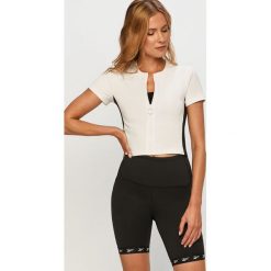 Reebok - T-shirt. Białe t-shirty damskie Reebok, s, bez wzorów, z elastanu, casualowe, z okrągłym kołnierzem. Za 99,90 zł.