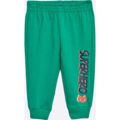 Blu Kids - Spodnie dziecięce 68-98 cm. Niebieskie spodnie chłopięce marki Blukids, z bawełny. W wyprzedaży za 14,90 zł.