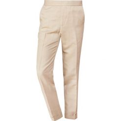 Filippa K TERRY CROPPED SLACKS Spodnie materiałowe sand paper. Brązowe spodnie męskie marki Filippa K, m, bez wzorów, z elastanu. Za 739,00 zł.