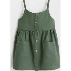 Mango Kids - Sukienka dziecięca Lulu 80-104 cm. Żółte sukienki dziewczęce Mango Kids, bez wzorów, z bawełny, casualowe, bez rękawów, rozkloszowane. Za 79,90 zł.