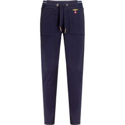 Spodnie AERONAUTICA MILITARE. Niebieskie spodnie damskie Aeronautica Militare, z dzianiny. Za 530,00 zł.