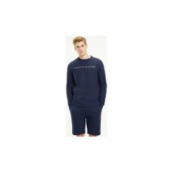Bluzy Tommy Hilfiger UM0UM01209 TRACK TOP. Niebieskie bluzy męskie TOMMY HILFIGER, s, bez wzorów, bez kołnierzyka, bez rękawów, bez kaptura. Za 280,61 zł.