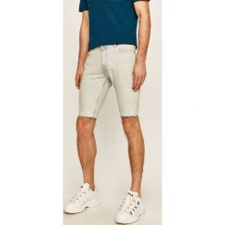 Tommy Hilfiger - Szorty jeansowe x Lewis Hamilton. Niebieskie spodenki i szorty męskie TOMMY HILFIGER, bez wzorów, z elastanu, casualowe. Za 539,90 zł.