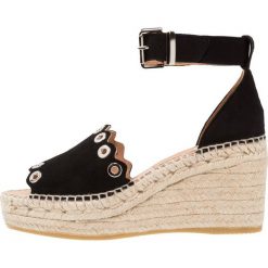 Kanna CAPRI Sandały na platformie black. Czarne sandały damskie marki Kanna, z materiału, na koturnie. Za 509,00 zł.