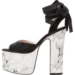 Shellys London INAMI Sandały na obcasie black. Czarne sandały damskie marki Shellys London, ze skóry ekologicznej, na obcasie. W wyprzedaży za 354,50 zł.