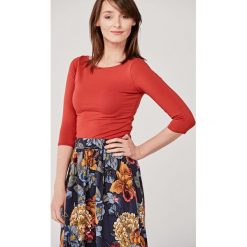 Bluzka Ribolla Tandori Spice XXS pomarańczowy. Pomarańczowe bluzki damskie Marie Zélie, s, w paski, z elastanu, bez kołnierzyka, bez rękawów. Za 127,00 zł.