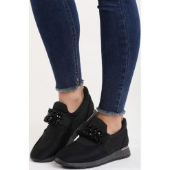 Czarne Buty Sportowe Loud Silence. Czarne buty sportowe damskie marki DOMYOS, z bawełny. Za 79,99 zł.