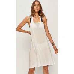 Calvin Klein - Sukienka plażowa. Białe stroje kąpielowe damskie Calvin Klein, na co dzień, s, bez wzorów, z wiskozy, z okrągłym kołnierzem, bez rękawów, proste. W wyprzedaży za 229,90 zł.