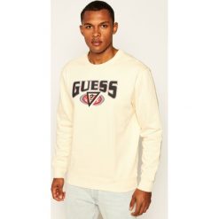 Bluza Guess J BALVIN Japan M0FI0M RA1C0. Brązowe bluzy męskie Guess, m, z aplikacjami, bez kołnierzyka, bez rękawów, bez kaptura. W wyprzedaży za 299,00 zł.