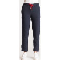 SPODNIE DRESOWE EMPORIO ARMANI. Niebieskie spodnie damskie Emporio Armani, z dresówki. Za 419,50 zł.