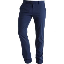 Colmar CROKE Spodnie materiałowe prussian blue. Niebieskie spodnie męskie marki Colmar, m, bez wzorów, z elastanu, sportowe, długie. W wyprzedaży za 471,75 zł.