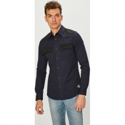 Calvin Klein Jeans - Koszula. Niebieskie koszule męskie Calvin Klein Jeans, s, bez wzorów, z elastanu, klasyczne, z klasycznym kołnierzykiem, z długim rękawem. W wyprzedaży za 279,90 zł.
