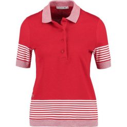 Lacoste Koszulka polo rouge/farine. Czerwone bluzki damskie Lacoste, z bawełny, polo. W wyprzedaży za 356,85 zł.
