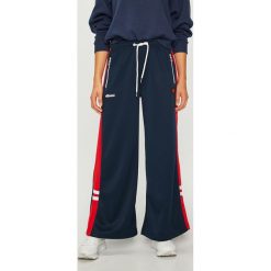 Ellesse - Spodnie. Niebieskie spodnie damskie Ellesse, bez wzorów, z poliesteru, casualowe. W wyprzedaży za 129,90 zł.