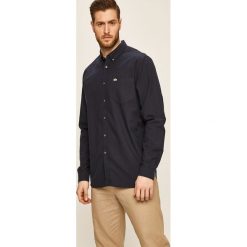 Lacoste - Koszula CH4976. Niebieskie koszule męskie Lacoste, bez wzorów, z bawełny, casualowe, button down, z długim rękawem. W wyprzedaży za 299,90 zł.
