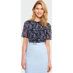 Elegancka bluzka. Bluzki damskie Greenpoint, bez wzorów, z poliesteru, eleganckie, bez kołnierzyka, bez rękawów. Za 89,99 zł.