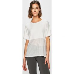 Calvin Klein Performance - Top. Białe bluzki damskie Calvin Klein Performance, s, bez wzorów, z elastanu, z okrągłym kołnierzem. W wyprzedaży za 179,90 zł.
