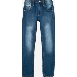 Blukids - Jeansy dziecięce 134-164 cm. Niebieskie jeansy męskie marki Blukids. W wyprzedaży za 39,90 zł.