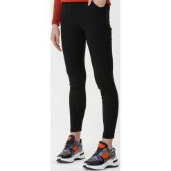 Czarne Legginsy Glenna. Czarne legginsy damskie Born2be, s, bez wzorów. Za 49,99 zł.