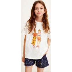 Mango Kids - Top dziecięcy Cool 110-152 cm. Białe bluzki dziewczęce Mango Kids, z nadrukiem, z bawełny, z okrągłym kołnierzem, z krótkim rękawem, krótkie, bez kaptura. Za 49,90 zł.