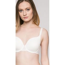 Triumph - Biustonosz Cool Sensation. Białe biustonosze z fiszbinami marki Triumph, z haftami, z elastanu. W wyprzedaży za 139,90 zł.