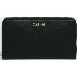 Calvin Klein - Portfel. Czarne portfele damskie Calvin Klein, bez wzorów, ze skóry ekologicznej. Za 299,90 zł.