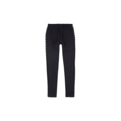 Getry dziewczęce we wzory. Czarne legginsy dziewczęce marki TXM. Za 19,99 zł.