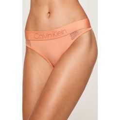 Calvin Klein Underwear - Stringi. Pomarańczowe majtki damskie Calvin Klein Underwear, s, z elastanu. Za 119,90 zł.