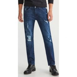 Jeansy z dziurami regular fit - Granatowy. Szare jeansy męskie regular marki Sinsay. Za 129,99 zł.