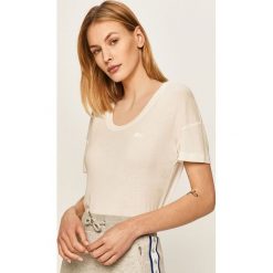 Lacoste - T-shirt. Białe bluzki damskie Lacoste, bez wzorów, z lyocellu, casualowe, z okrągłym kołnierzem, z krótkim rękawem. W wyprzedaży za 139,90 zł.