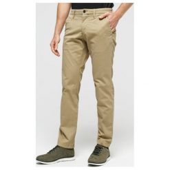 Timberland Spodnie Sargent Lake Stretch Twill Slim Chino , beżowy, rozmiar 30/32. Brązowe spodnie męskie Timberland, uniwersalny, w paski, z elastanu. W wyprzedaży za 319,99 zł.